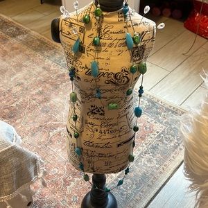 Long varying teals, aquas. Beaded with silver.